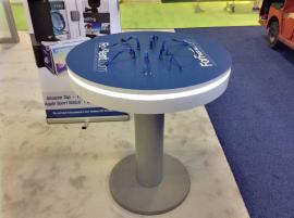 RENTAL: Custom Island Design with 18 & 14 ft. Canopy Structures with SEG Sheer Fabric, 18 ft. High Double-Sided Lightbox with One-Piece Silicone Edge Fabric Graphics -- Image 4