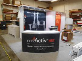 Custom Inline with (2) SEG Graphic Frames, Ceilings with LED Puck Lights, Monitor Mounts, MOD-1185 Reception Counter with Storage, and (2) LTK-1015 Pedestals