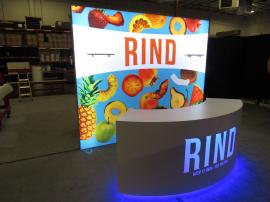 Modified VK-1968 SuperNova Lightbox with (2) Shelves, Fabric Graphics, and MOD-1584 Curved Reception Counter with Locking Storage