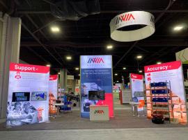 RENTAL: 16 ft Storage Closet Tower with Locking Door and Lightboxes on Front & Back, (4) 8&rsquo; ft. Wide x 12 ft. High Double-Sided Lightboxes, (2) RE-1576 Rectangular Counters with Recessed RGB LED Lighting, (2) RE-704 Charging Station Tables with USB Char