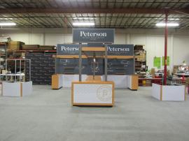 Custom Peninsula Island Exhibit with Gravitee Modular Panels (backwall), Laminated Bridge with Pendant Lights, Prep Counters with Storage, Reception Counter with Storage, Interior and Exterior Shelves, Locking Closet, and 3-sided Graphic Fa&ccedil;ade for Produ