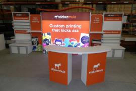 Custom SuperNova Lightbox Display with Backlit Graphic, Canopy, Shelves, Fabric and Direct Print Graphics, Locking Storage, and Custom Reception Counter