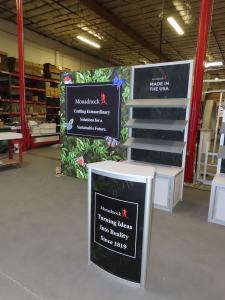 (2) Custom 10 ft. Exhibits with LED Lightbox, Slanted Shelves, Locking Storage, Fabric Graphics, and ECO-20C Counter -- View 2