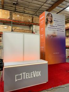 RENTAL: Island Design with Gravitee Panel System Storage Tower @ 96" Wide x 42" Deep x 190" High with Locking Door, Small Pedestal with White Laminate Finish, Conference Room @ 81" Wide x 102" Deep x 95" High with Clear Acrylic Infill Panels and Sliding B