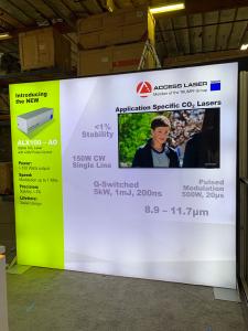RENTAL: RE-1079 Inline Design with 110" Wide x 96" High Single-Sided Lightbox, Large Monitor Mount, 50" Monitor, RE-1576 Reception Counter, SEG Backlit Fabric Graphic, and Vinyl Applied Graphic -- View 3