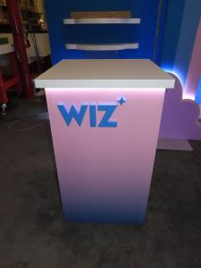 Custom Symphony Portable SYK-1038 Display with Fabric and Direct Print Graphics, Shelves, Rainbox Aero Tube Frame, Monitor Mount, Square Reception Counter, and Small Bistro Table -- View 3