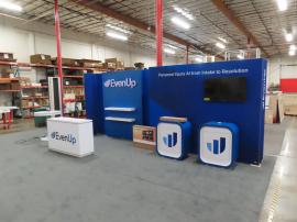 Custom Reconfigurable Gravitee Modular Inline with (2) Custom Radius Counters, (1) MOD-1725 Reception Counter with Vinyl Graphics and RGB Programable LED Lights, EdgeLit Logo, Shelves, Wireless Charging Pads, SEG Fabric Graphics, and Monitor Mounts