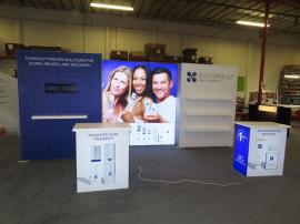 Gravitee Modular Inline Exhibit with Tension Fabric Graphics, SuperNova Lightbox, Shelves, Monitor Mount, Closet Storage, and (2) MOD-1703 Reception Counters -- View 2