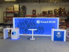 Modified VK-2985 Custom Inline (w/ reconfigure to VK-1340). Includes SEG and Vinyl Graphics, Backlighting, MOD-1563 Counter with Locking Storage and RGB Lights, MOD-1715 Modified Custom Counter, (2) MOD-1453 Charging Tables with Custom Charging Pads, and