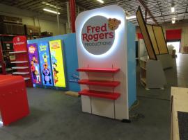 Reconfigurable Gravitee Modular Exhibit with Closet Door Storage, Halo Lit Logo, Shelving, Monitor Mount, (3) Hanging Backlit Graphics, (4) Literature Holders, and (2) Custom Reception Counter with LED Accent Lights and Locking Storage -- View 2