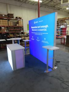 VK-1970 Backlit SuperNova Exhibit with Tension Fabric Graphic and MOD-1700 Backlit Counter with Locking Storage  -- View 2