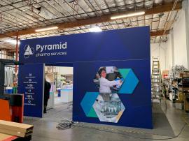 RENTAL: Island Design with L-Shaped Gravitee Panel System Backwall -- View 4